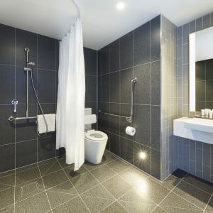 Accessible bathroom with roll-in design for guests using a wheelchair