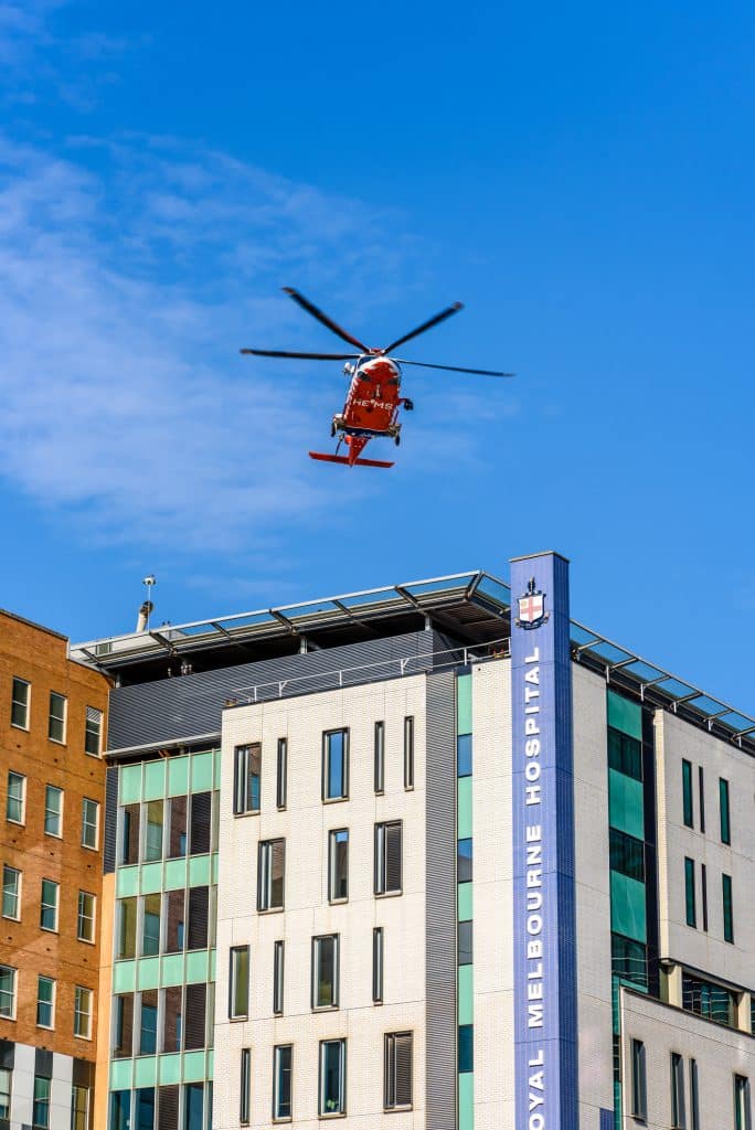 MediStays supports families and loved ones staying near the hospital. Image: emergency ambulance Helicopter is landing on the rooftop of the Royal Melbourne Hospital.
