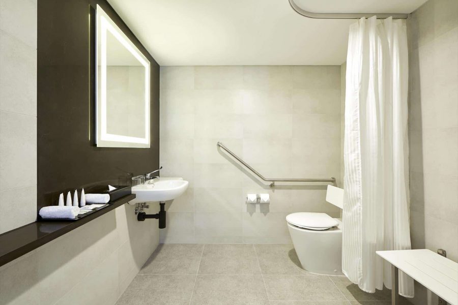 MediStays hotel accessible bathroom with shower for country patients staying near the hospital.