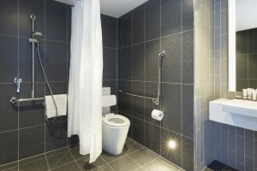 Accessible bathroom with roll-in design for guests using a wheelchair
