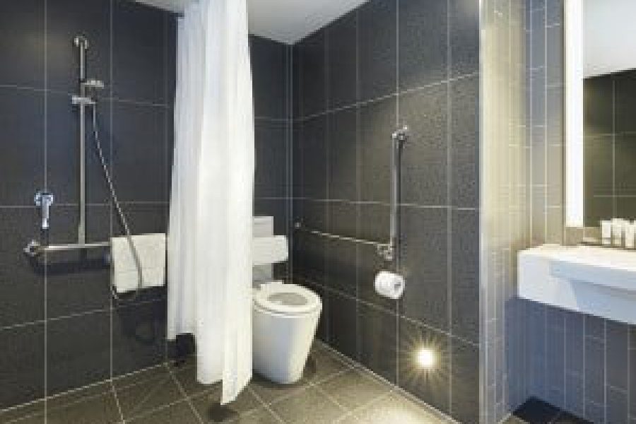 MediStays hotel accessible bathroom with shower for country patients staying near the hospital.